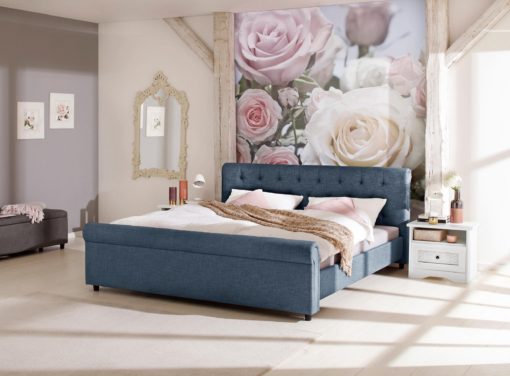 Atrakcyjne tapicerowane łóżko ze stylowym wezgłowiem, niebieskie